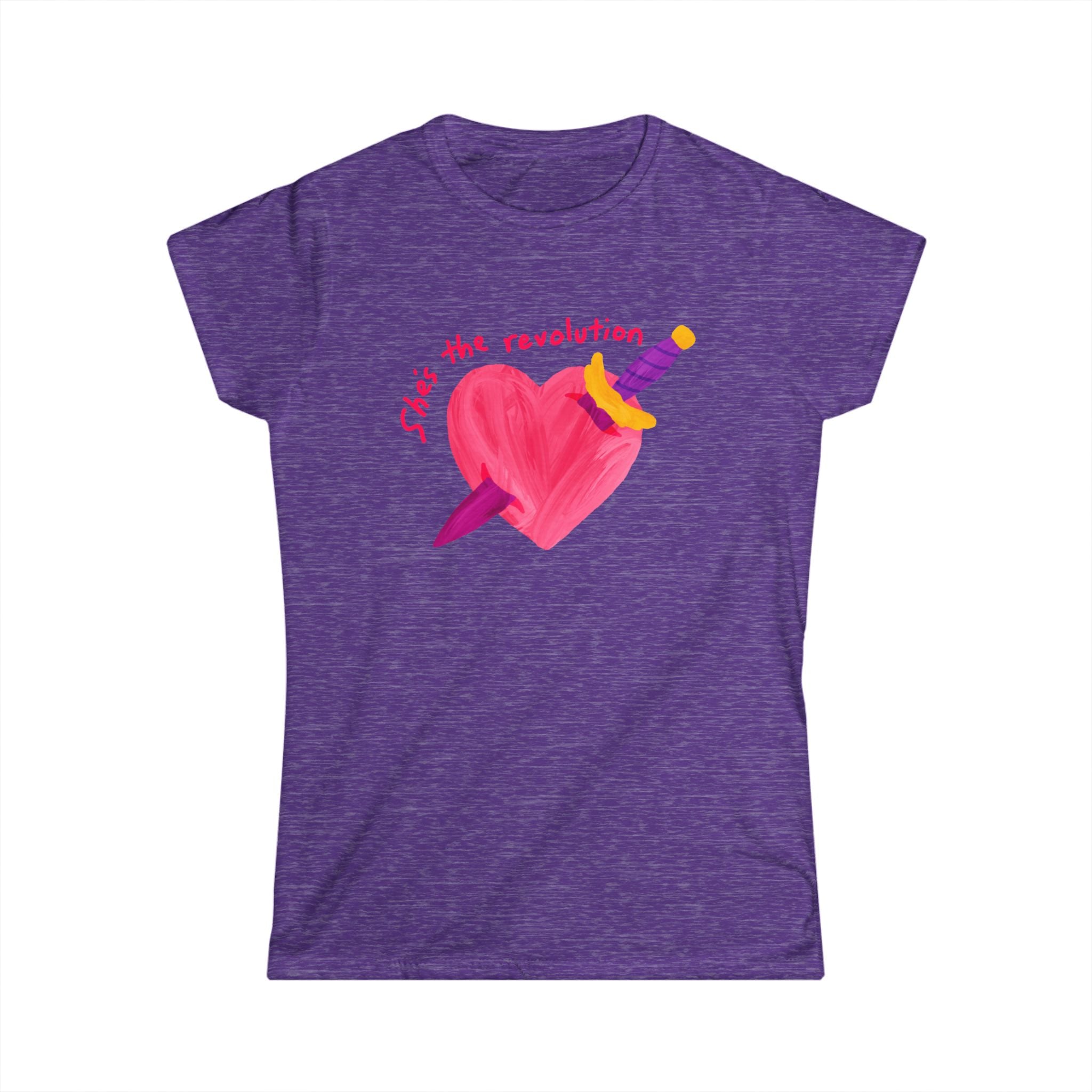 Women’s feminist purple t-shirt with a pink heart and sword graphic and red text that reads “she’s the revolution”