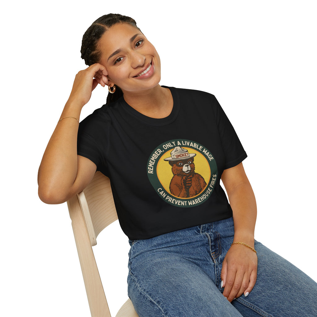 Woman wearing a black t-shirt with colorful text, sitting on a white background