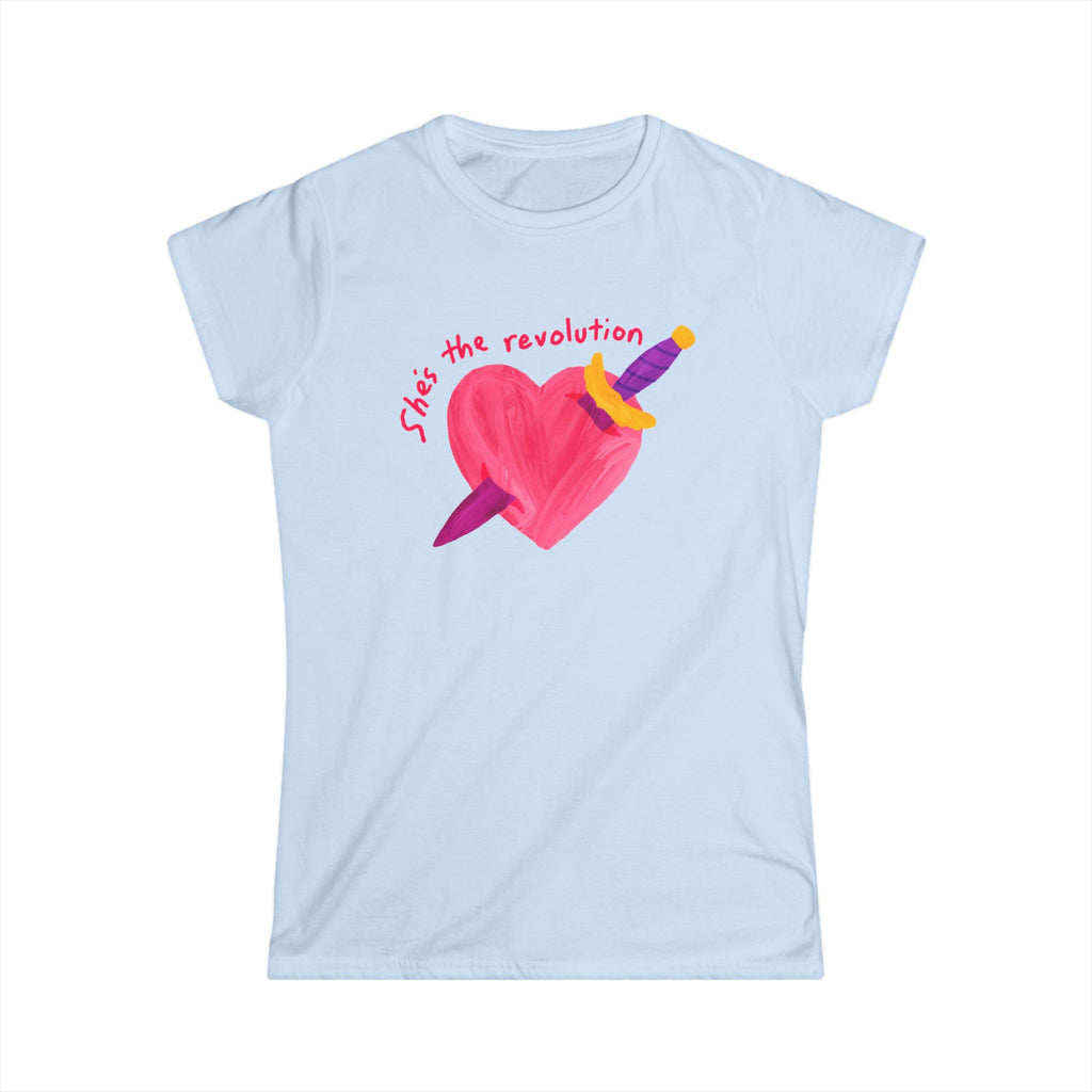 Women’s feminist light blue t-shirt with a pink heart and sword graphic and red text that reads “she’s the revolution”