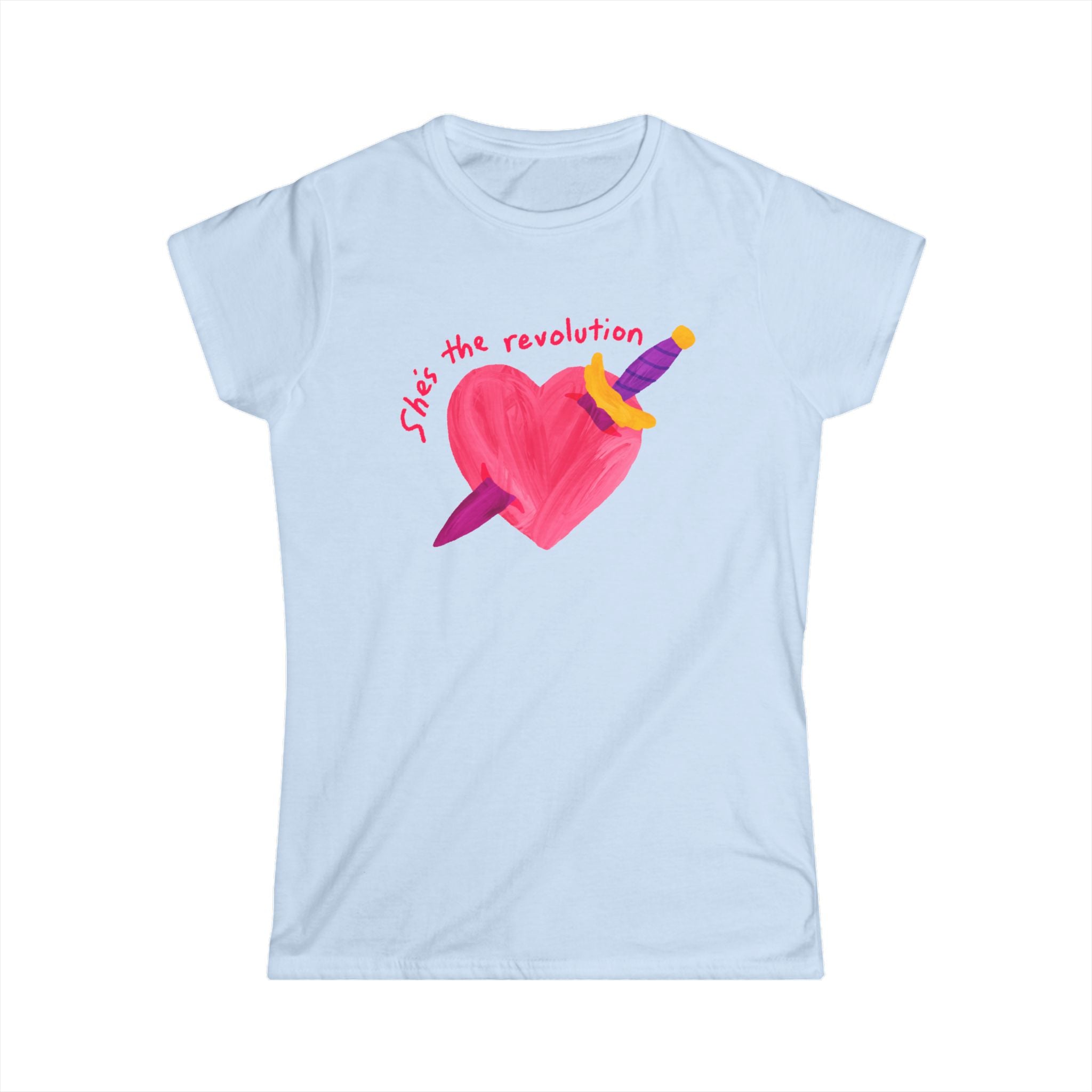 Women’s feminist light blue t-shirt with a pink heart and sword graphic and red text that reads “she’s the revolution”