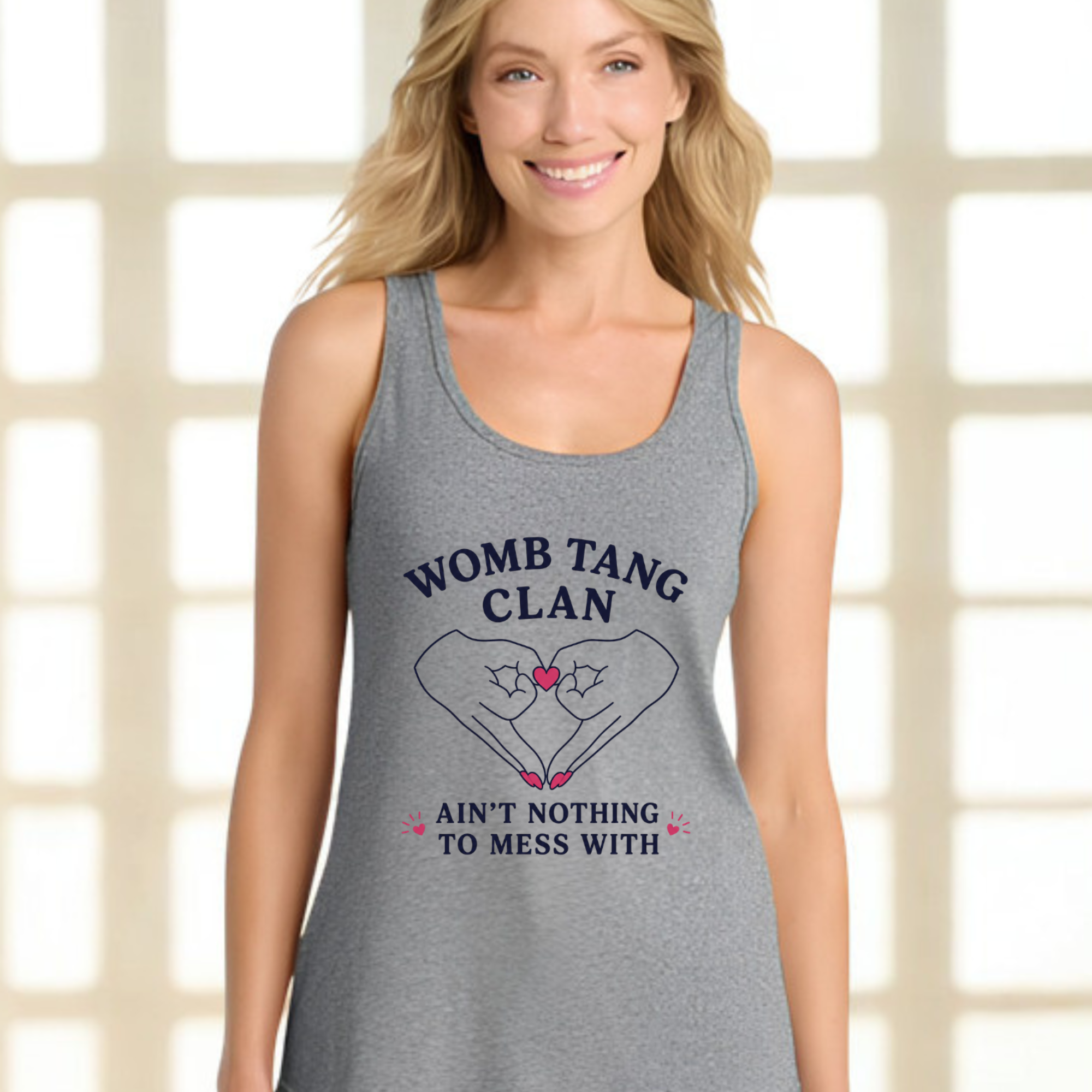 heather gray racerback tank top. Graphic features two hands with pink nails forming a heart shape with a pink heart center. Text reads “Womb Tang Clan — Ain’t Nothing to Mess With.” Funny feminist tank top, sarcastic women’s empowerment shirt, hip hop parody tee, reproductive rights gift, bold statement tank for women.