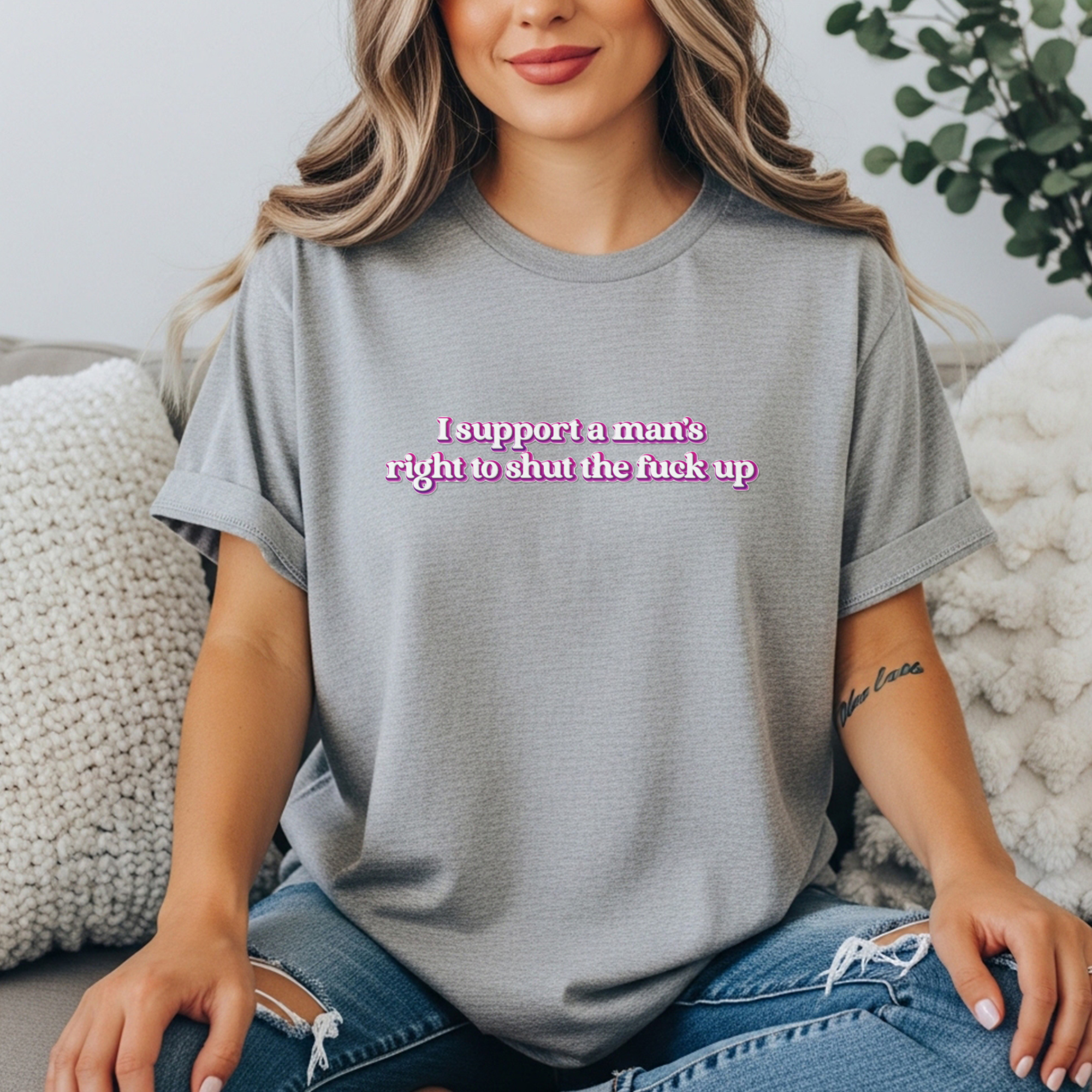 Women’s gray feminist t shirt with pink and white bubble text  “I support a man’s right to shut the fuck up”