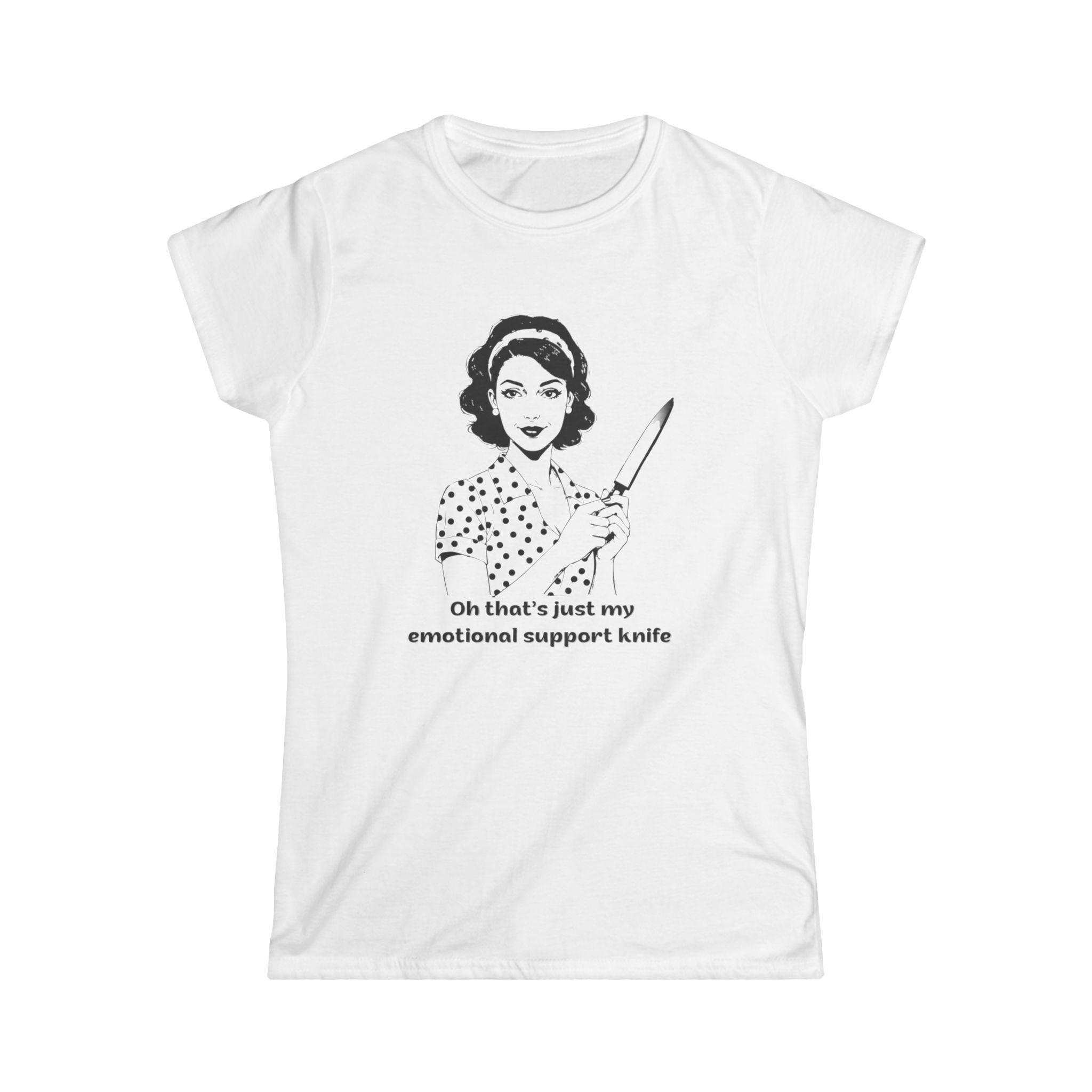 White t-shirt featuring a vintage-style black line illustration of a 1950s housewife in a polka dot dress holding a large kitchen knife, with the text: “Oh that’s just my emotional support knife.”